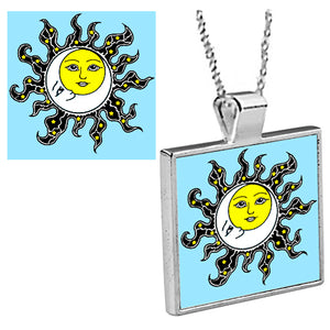 "Sun and Moon"  is an original Kathryn Rutherford work of graphic art reproduced as a silver bezel pendant with 18 inch silver plated chain with bale clasp, printed on high gloss aluminum set inside a silver plated bezel.